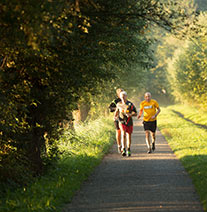 Thumbnail - Three elderly male runners in a park